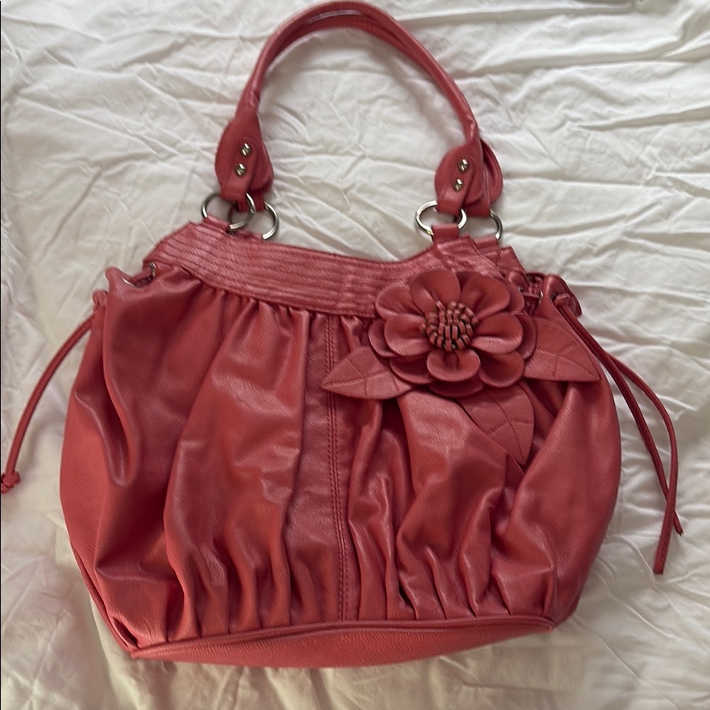 Elegant Coral Handbag with Floral Accent by Fiorelli